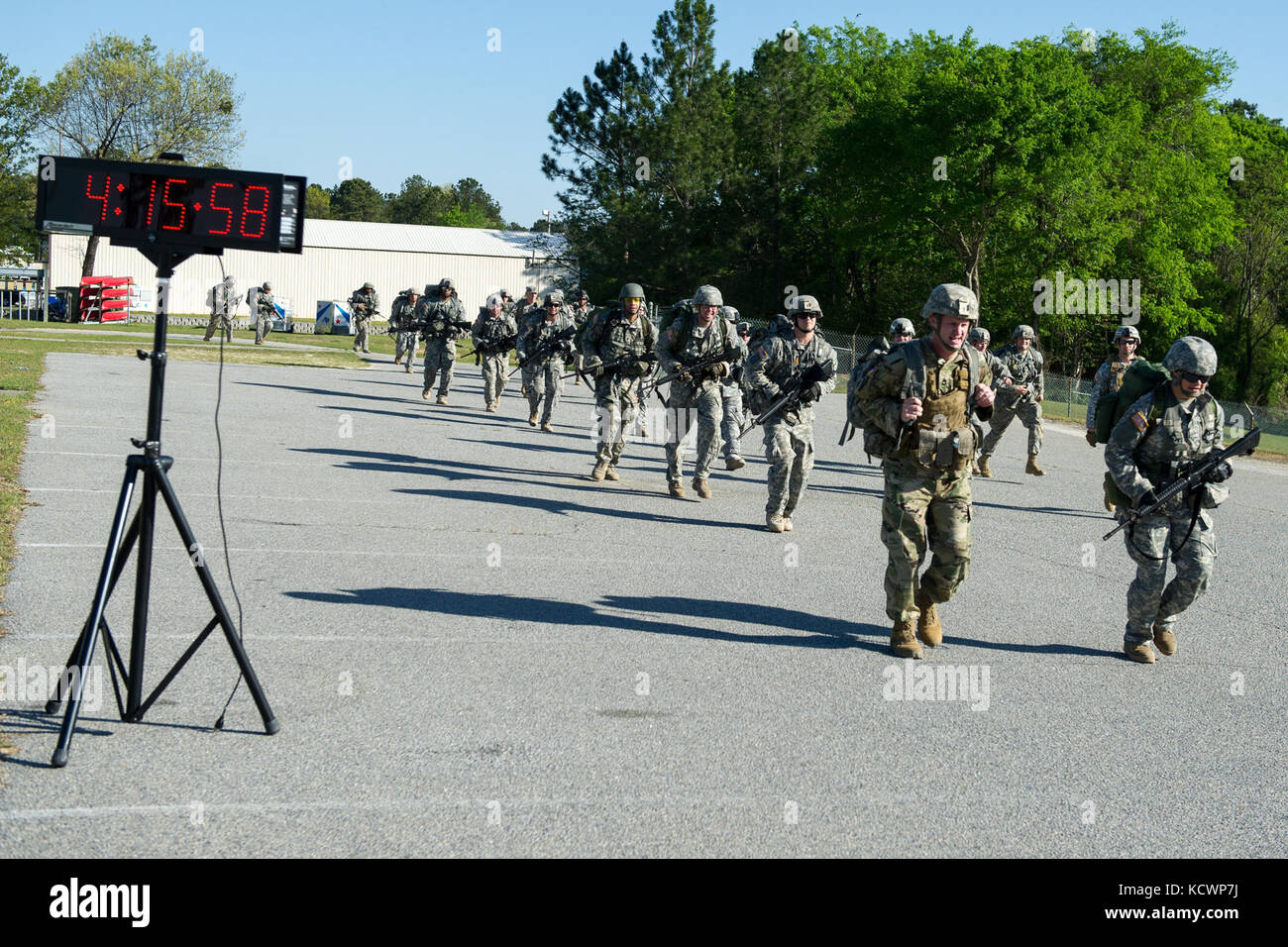 U.S. Soldiers assigned to the Florida Army National Guard conduct a 12 mile ruck march with 218th Regiment (Leadership), South Carolina Army National Guard 12 Bravo Combat Engineer instructors at McCrady Training Center, in Eastover, S.C. April 4, 2016. The ruck march is part of the combat engineer military occupation specialty retraining for soldiers transitioning to the 12 bravo career field, this class was the first to train women going into the career field at McCrady. (U.S. Air National Guard photo by Tech. Sgt. Jorge Intriago) Stock Photo