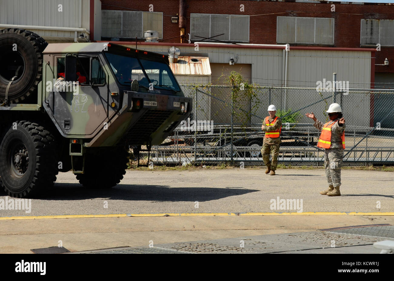 Members of the 218th Brigade Support Battalion, South Carolina National Guard, partnered with the U.S. Army Reserve to conduct port operations training in Charleston, South Carolina, Aug. 22, 2016, as part of Exercise Trans Warrior 16. The exercise provided the Soldiers with hands-on training for loading vehicles onto a naval vessel. (U.S. Army National Guard photo by 1st Lt. Jessica Donnelly, 108th Public Affairs Detachment) Stock Photo