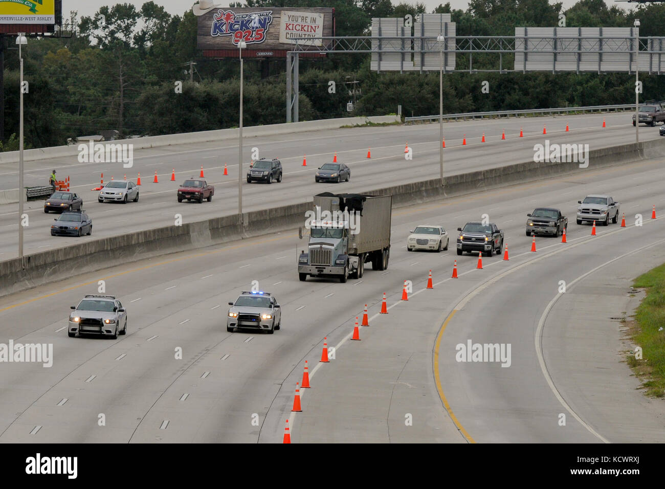 Patrolmen with the S.C. Highway Patrol lead the first vehicles down interstate I-26 westbound after the lane reversal out of Charleston as part of the evacuation ordered by the Governor of South Carolina.  Hurricane Matthew peaked as a Category 4 hurricane in the Caribbean and was projected to pass over the southeastern U.S., including the S.C. coast. Approximately 1,400 S.C. National Guard Soldiers and Airmen were activated Oct. 4, 2016, to support coastal evacuations after Governor Nikki Haley declared a State of Emergency. (U.S. Army National Guard photo by. Staff Sgt. Kevin Pickering, 108t Stock Photo