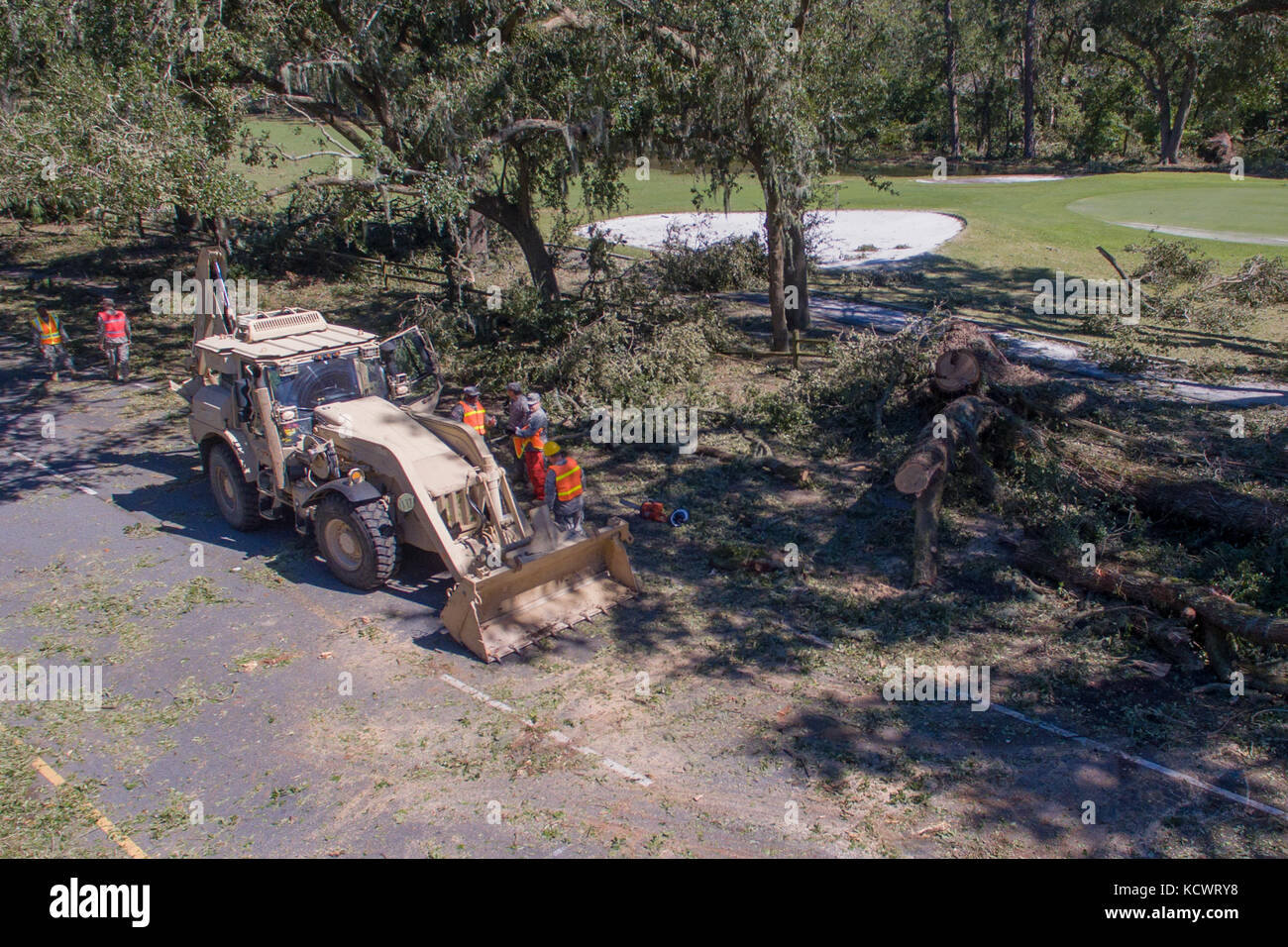 oldiers with 1263rd Forward Support Company and 125th Engineers for the South Carolina Army National Guard, work to remove debris and clear the roadways in Hilton Head Island, South Carolina, Oct. 9, 2016. Approximately 2,800 S.C. National Guard Soldiers and Airmen have been activated since Oct. 4, 2016, to support state and county emergency management agencies and local first responders after Governor Nikki Haley declared a State of Emergency. (U.S. Army National Guard photo by Sgt. Brian Calhoun, 108th Public Affairs Detachment) Stock Photo