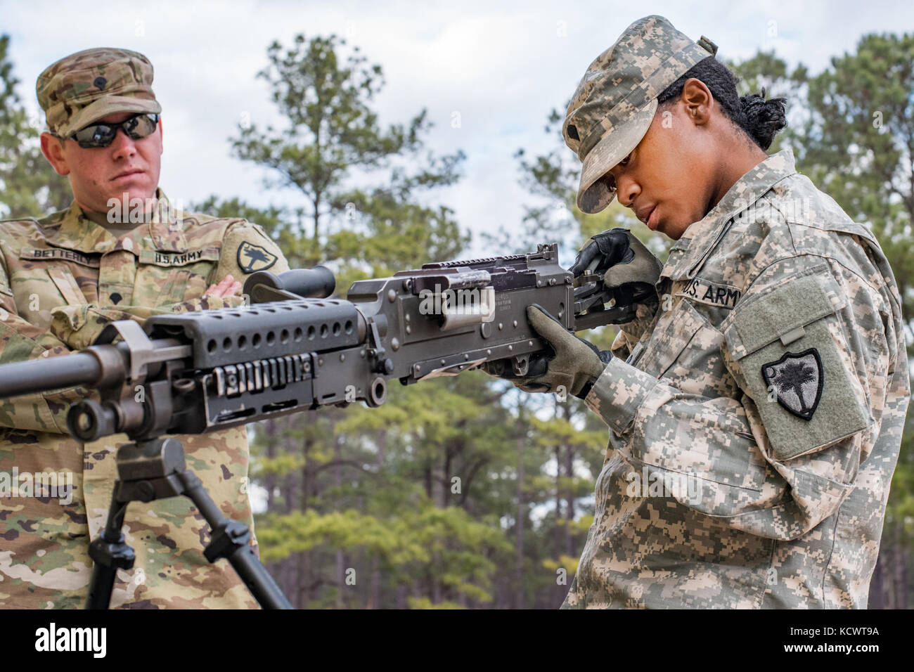 U.S. Army Spc. Valetta Burgess, 59th Aviation Troop Command, South Carolina Army National Guard, performs a functions check on the M249 Squad Automatic Weapon during the Best Warrior 2017 Competition at McCrady Training Center in Eastover, South Carolina, Jan. 29, 2017. The five-day event consisted of a road march, physical fitness test, and weapons qualification events, among others. Participants competed as individuals with an enlisted and non-commissioned officer winner being announced Feb. 1, 2017. (U.S. Army National Guard photo by Sgt. Brian Calhoun, 108th Public Affairs Det.) Stock Photo