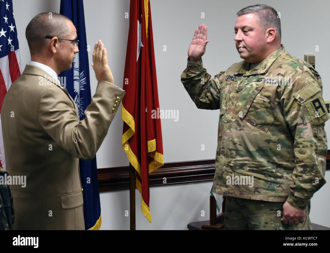 U.S. Army Capt. Jeffrey Shealy was recognized as the newest chaplain for the South Carolina National Guard at the Adjutant General Building in Columbia, South Carolina, Feb. 9, 2017. Shealy was sworn in by U.S. Army Brig. Gen. R. Van McCarty, Assistant Adjutant General – Army for the South Carolina National Guard, and U.S. Army Col. Robert Bailes, Senior Army Advisor to South Carolina National Guard, administered the Oath of Office. Shealy will serve as the chaplain for the 351st Aviation Support Battalion. (U.S. Army National Guard photo by Capt. Jessica Donnelly) Stock Photo