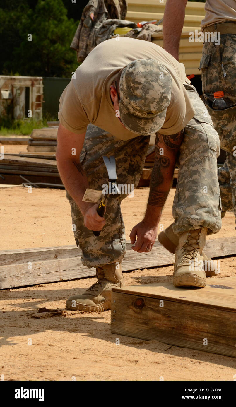 Two squads of South Carolina National Guard Soldiers from the 1223rd Engineer Company (Vertical), 178th Engineer Battalion, compete to assemble a small room during the Best Engineer Competition at the McCrady Training Center Aug. 5, 2016. This is the second year of the combined competition between the 178th and 122nd Engineer Battalions. (U.S. Army photo by 1st Lt. Jessica Donnelly, 108th Public Affairs Detachment) Stock Photo