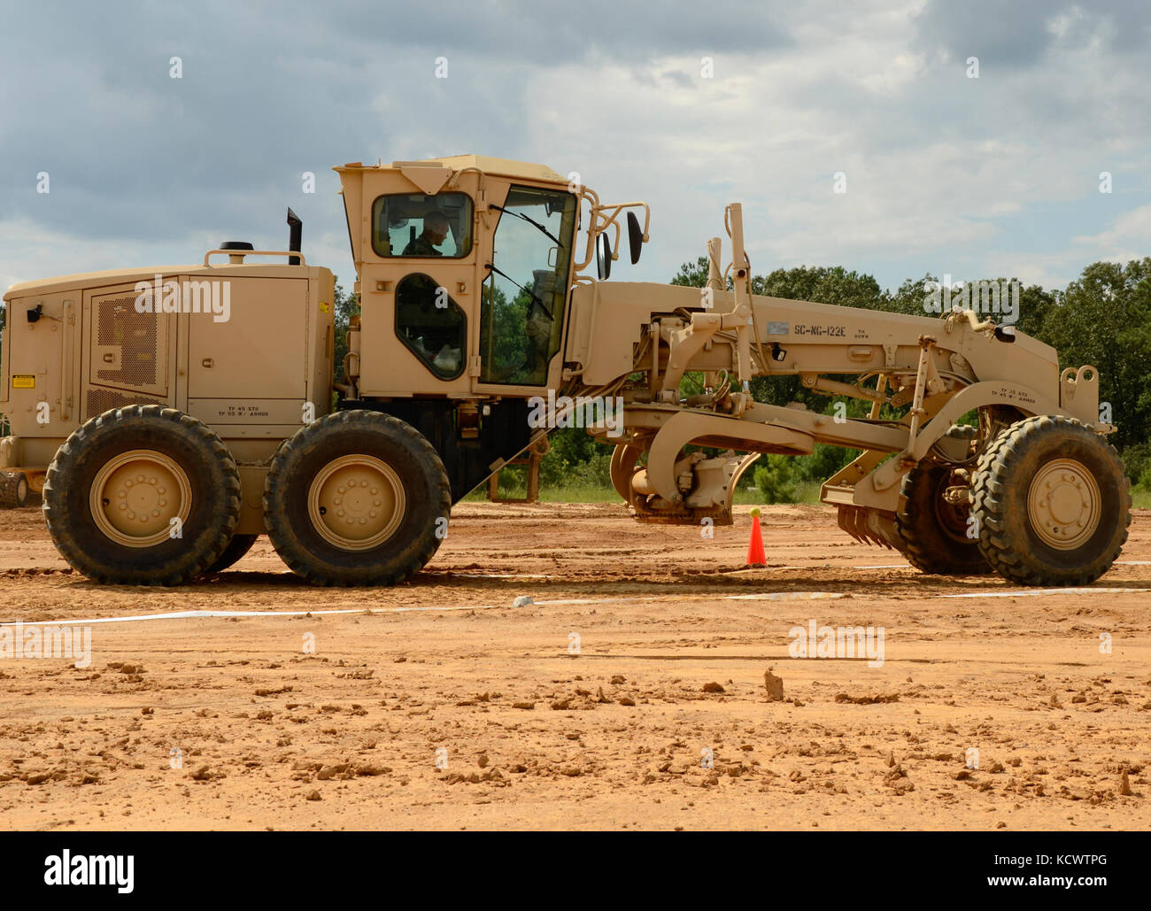 South Carolina National Guard Soldiers from the 124th Engineer Company, 172nd Engineer Platoon and the 1782nd Engineer Company competed in the Best Engineer Competition at the McCrady Training Center Aug. 5, 2016. As one of the horizontal engineer tasks, each Soldier had to operate a motor grader in a confined space by maneuvering the vehicle without knocking a softball off the top of a cone. This is the second year of the combined competition between the 178th and 122nd Engineer Battalions. (U.S. Army photo by 1st Lt. Jessica Donnelly, 108th Public Affairs Detachment) Stock Photo