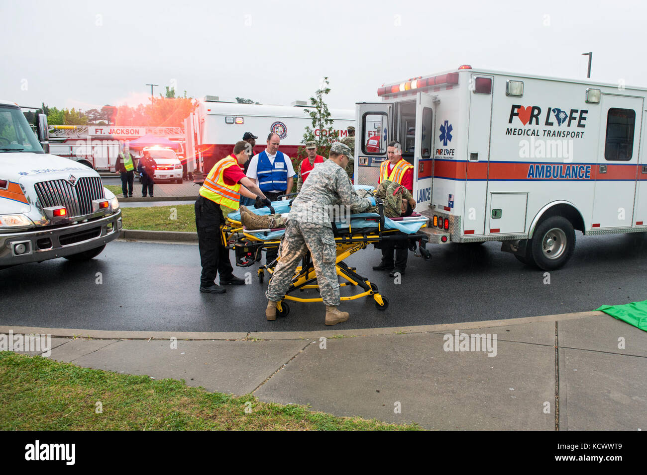 First responder from multiple hospitals, fire departments and law enforcement agencies from around the Columbia, South Carolina, area triage basic trainees during a mass casualty exercise at Fort Jackson, S.C., April 12, 2016. The exercise tested first responder capabilities and Fort Jackson’s command and control personnel. (U.S. Air National Guard Tech Sgt. Jorge Intriago) Stock Photo