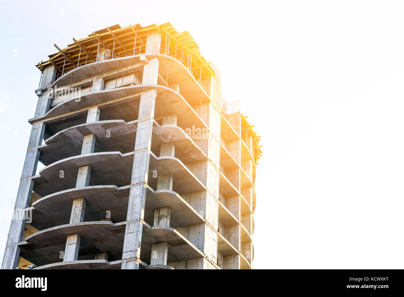 Concrete high storey building frame under construction. Soft light ...