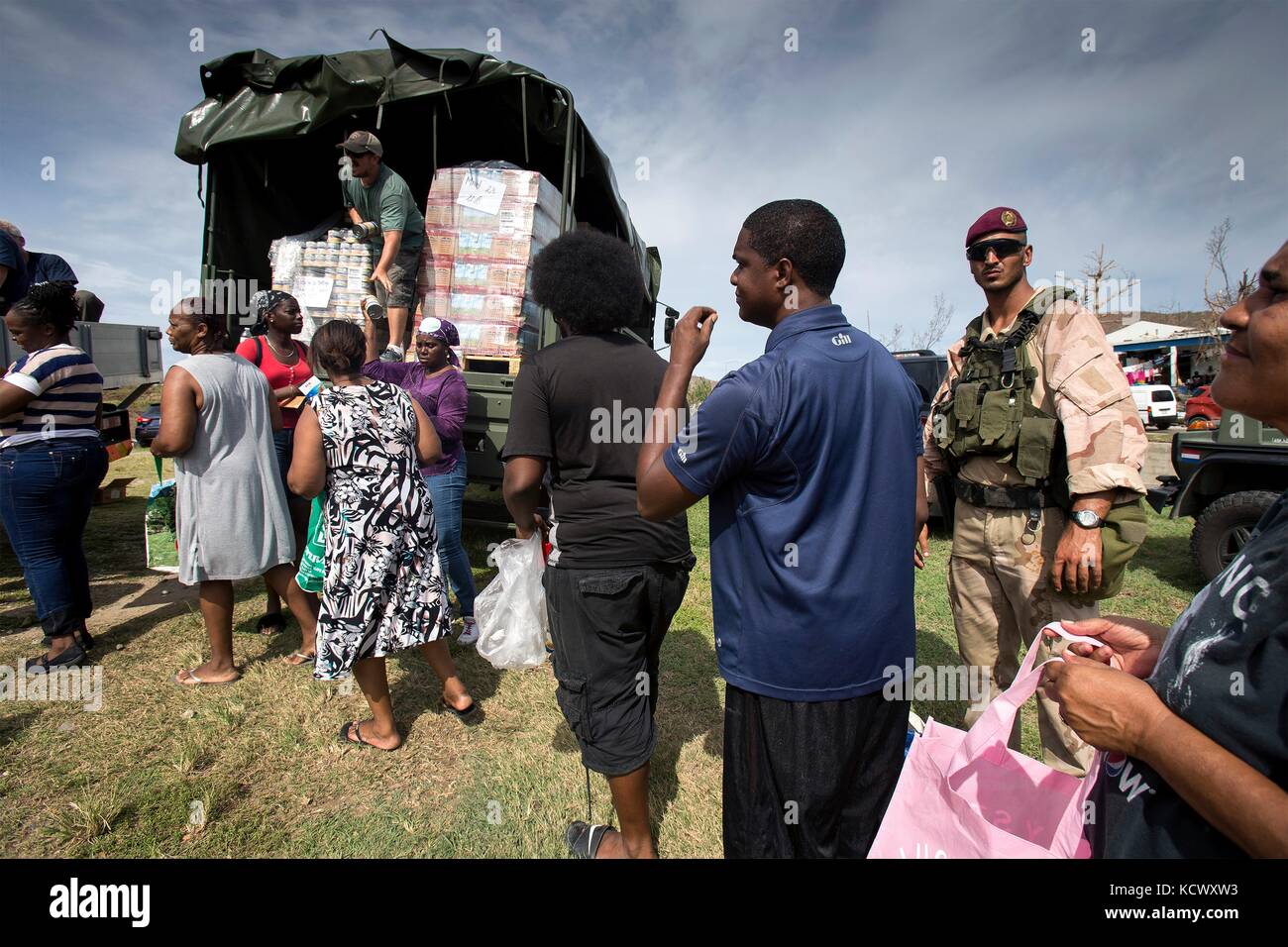 Royal Dutch Marines guard food aid at a humanitarian relief distribution point in the aftermath of Hurricane Irma that devastated much of the island September 14, 2017 in Philipsburg, St. Maarten. Stock Photo