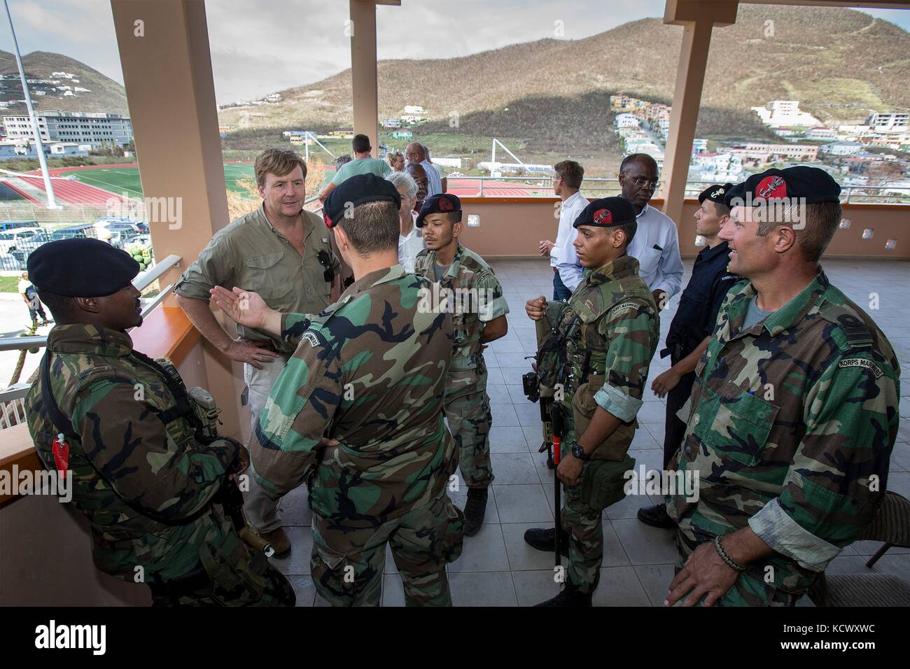 King Willem-Alexander of the Netherlands is briefed by Royal Dutch Marines during a tour of the destruction caused by Hurricane Irma September 11, 2017 in Philipsburg, St. Maarten. Stock Photo