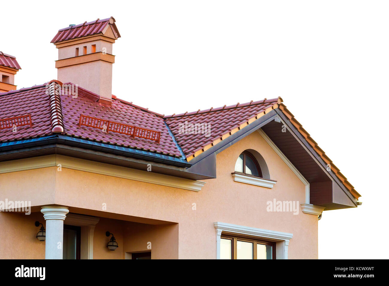 Roof on a new luxury house made of red natural bricks and a big chimney ...