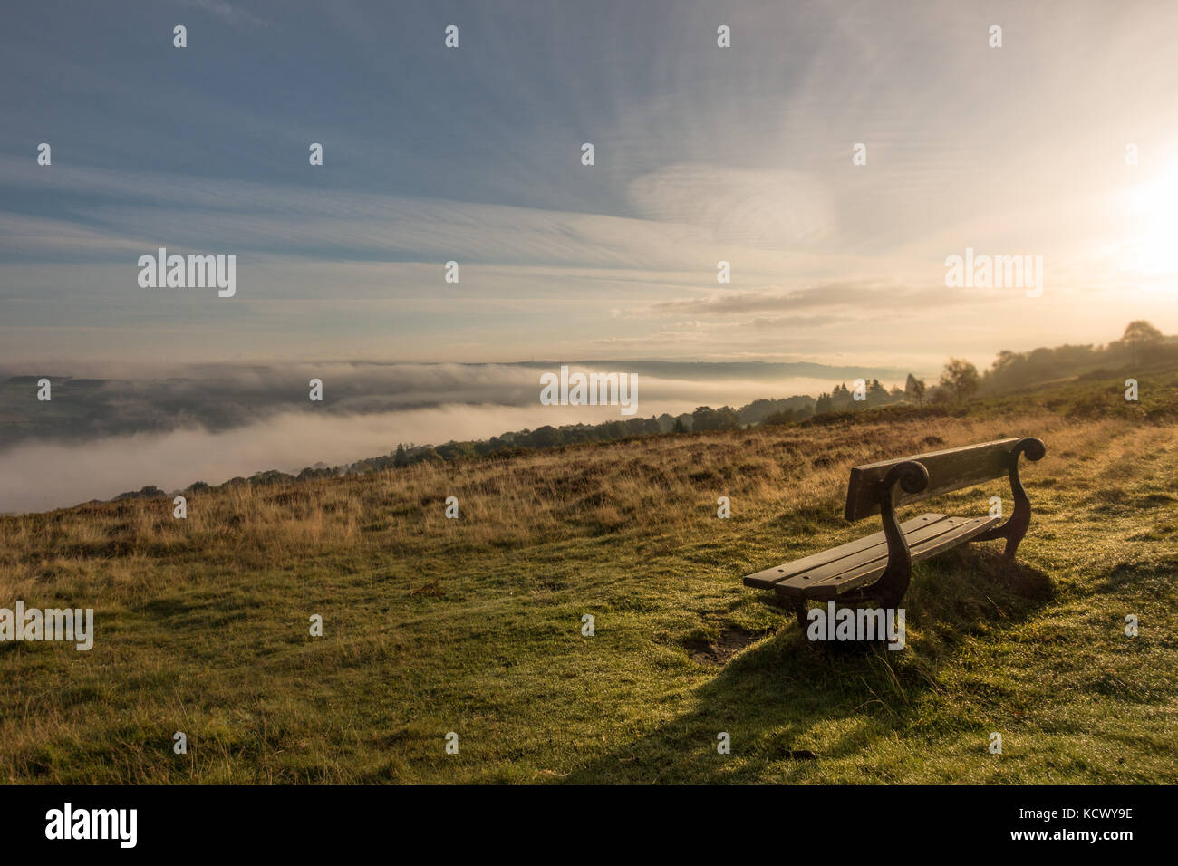 One of the finest views in Yorkshire, looking over Wharfedale from a bench in a beautiful cloud inversion, Ilkley Moor, UK Stock Photo