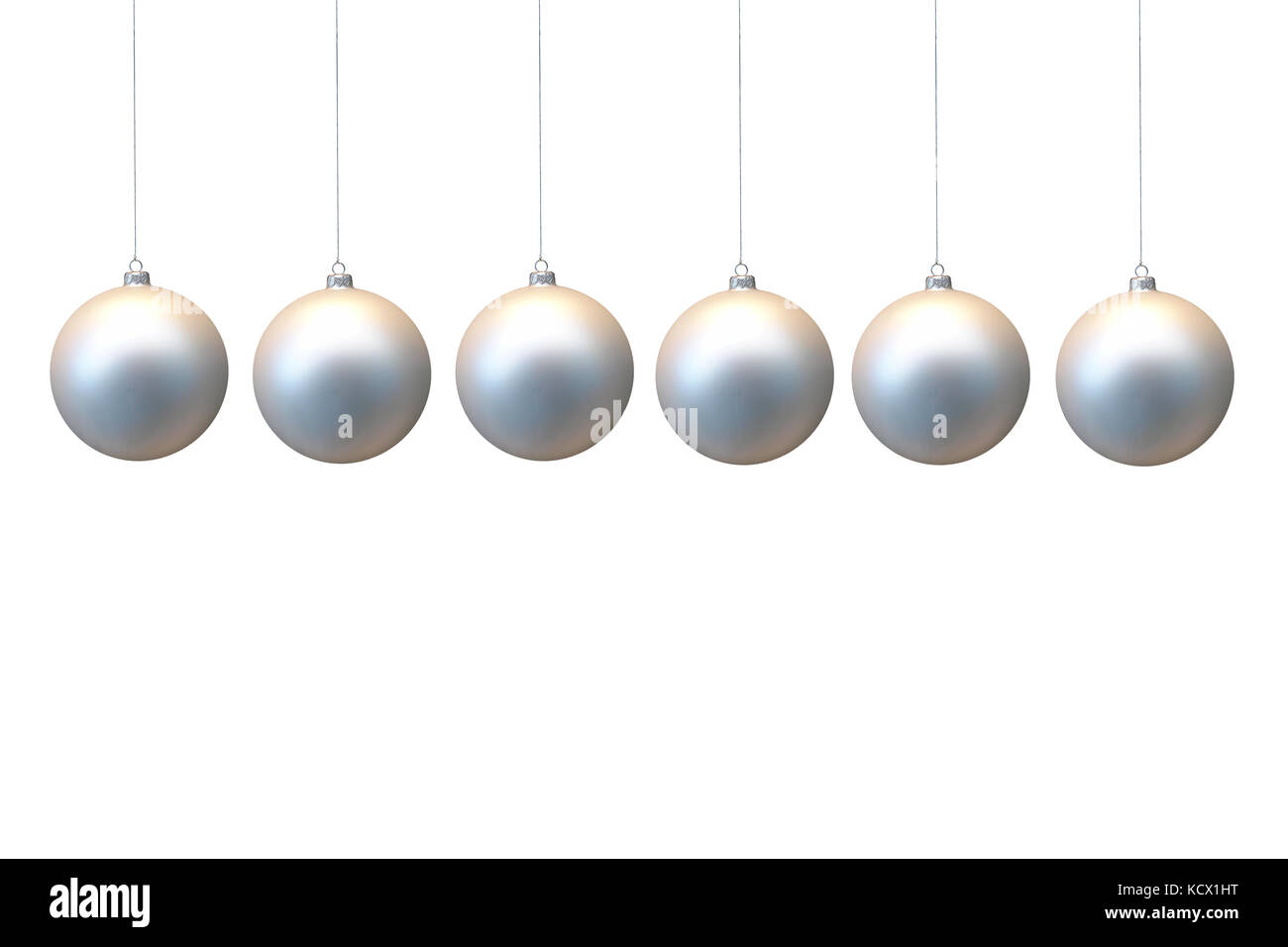 Row of silver christmas balls hanging on strings over white background Stock Photo