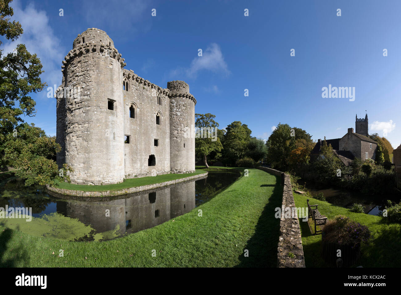 Ruins of Nunney Castle and All Saint's Church, Nunney, near Frome, Somerset, England, United Kingdom, Europe Stock Photo
