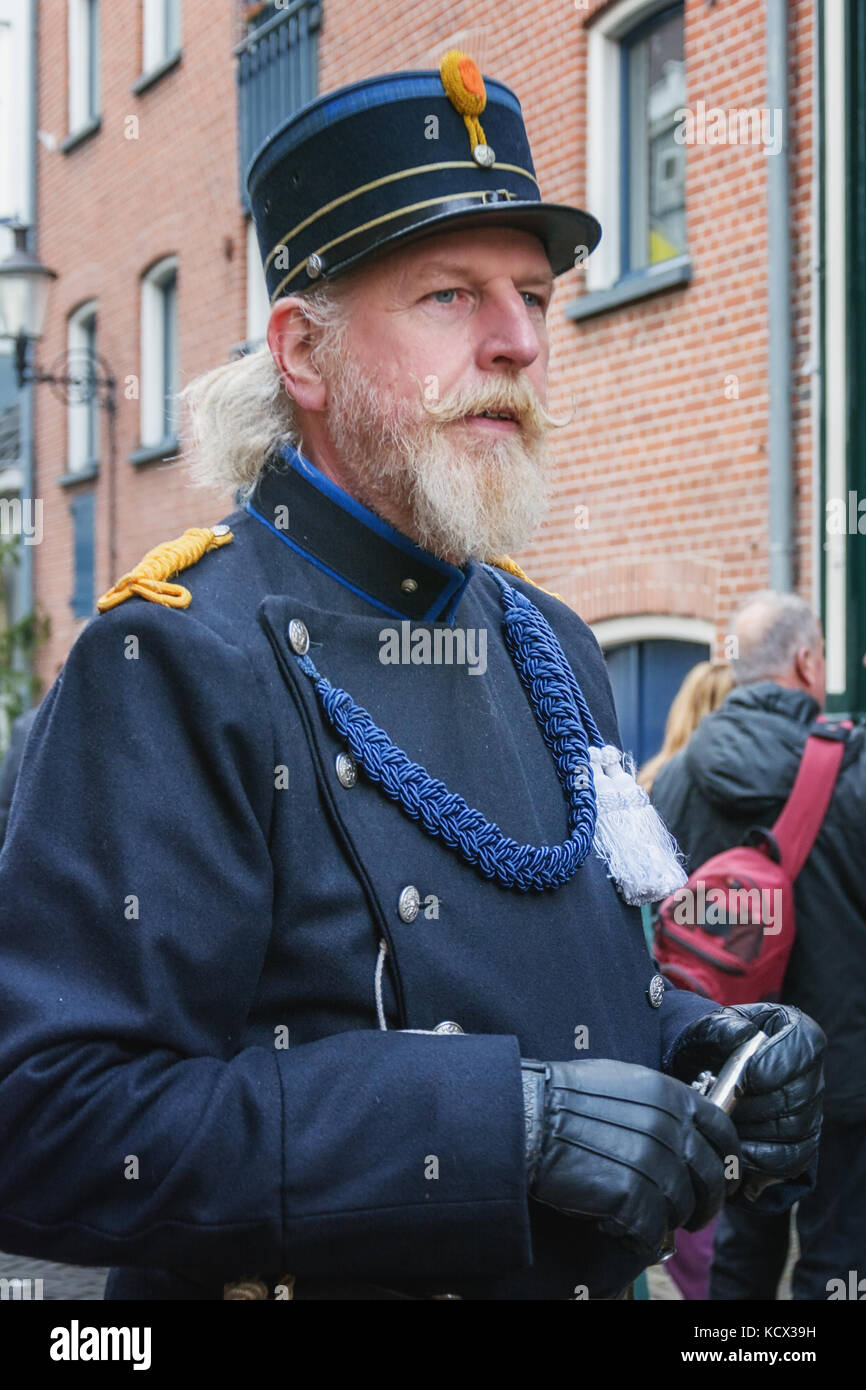 Deventer, Netherlands – December 18, 2016: Policeman one of the characters from the famous books of Dickens during the Dickens Festival in Deventer in Stock Photo