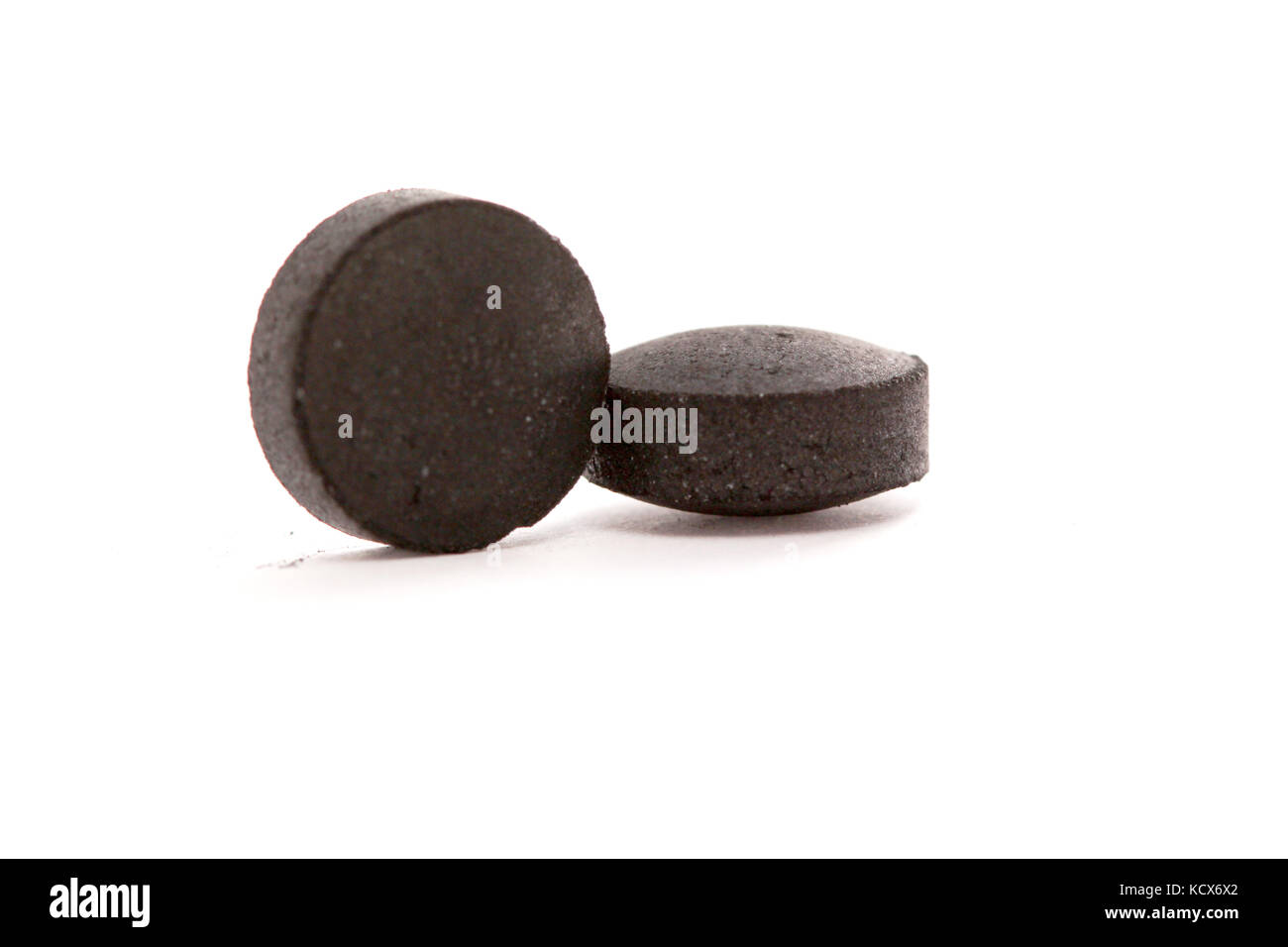 picture of a activated coal tablets isolated on white Stock Photo Alamy