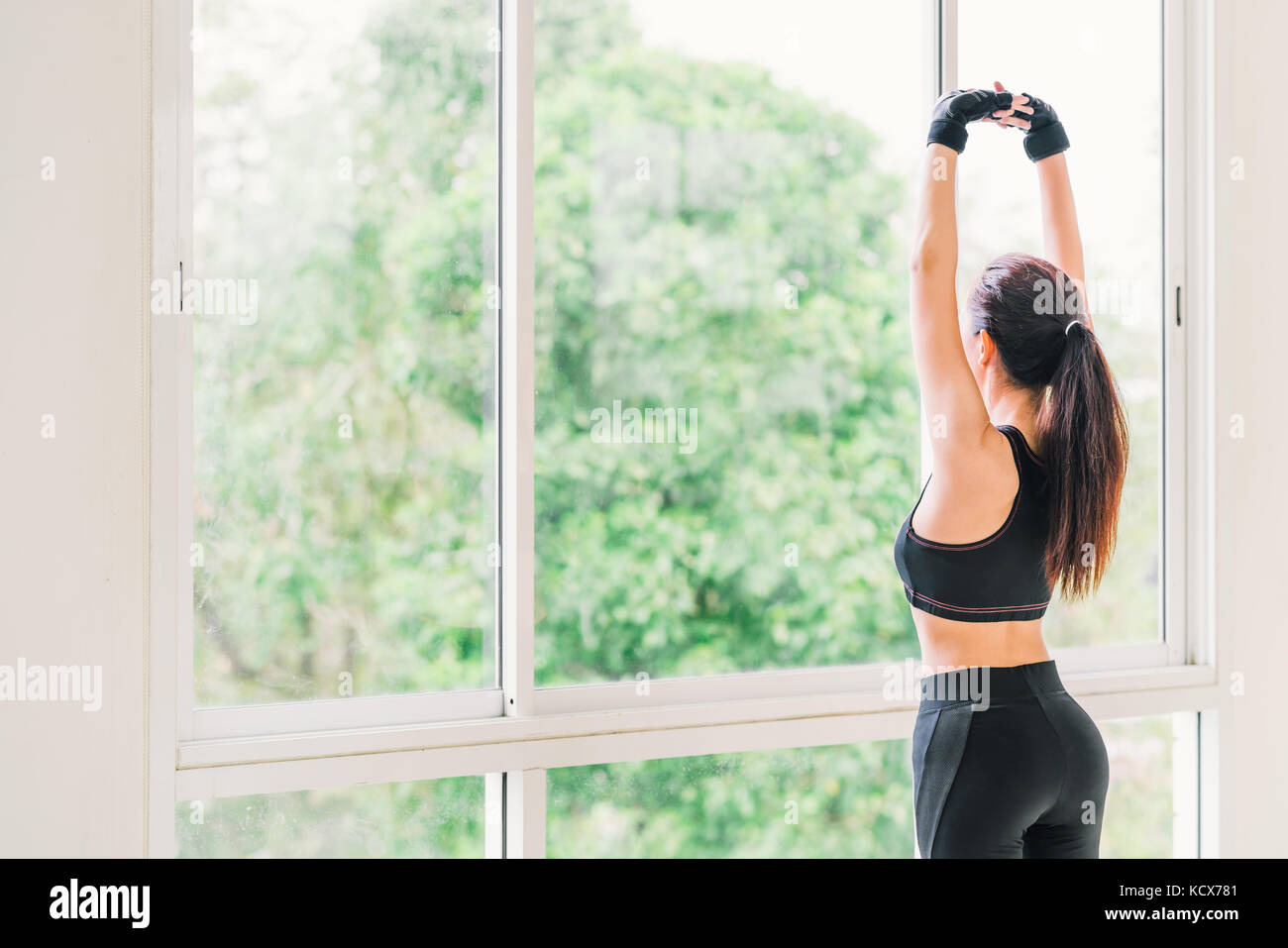 Sexy young Asian girl stretching arms exercise at fitness sport club or  home gym. Yoga aerobic class, lean firm body trainer, weight loss, fat burn  Stock Photo - Alamy