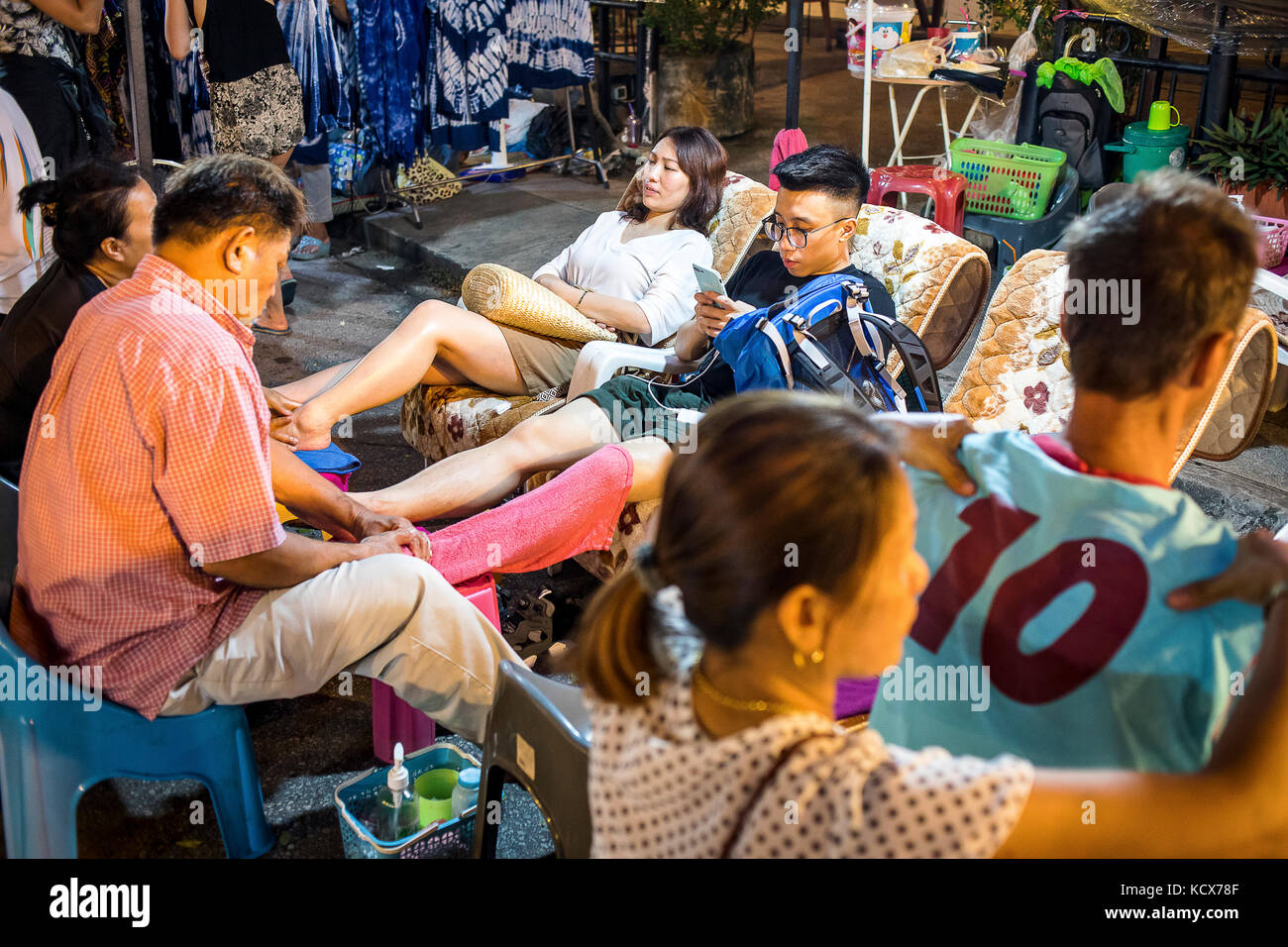 Massage in the street, Sunday evening market or walking street, Chiang Mai, Thailand Stock Photo