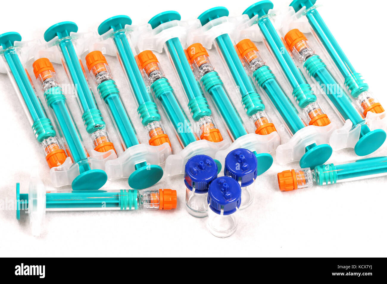 Green plastic syringes pile with glass vials Stock Photo Alamy