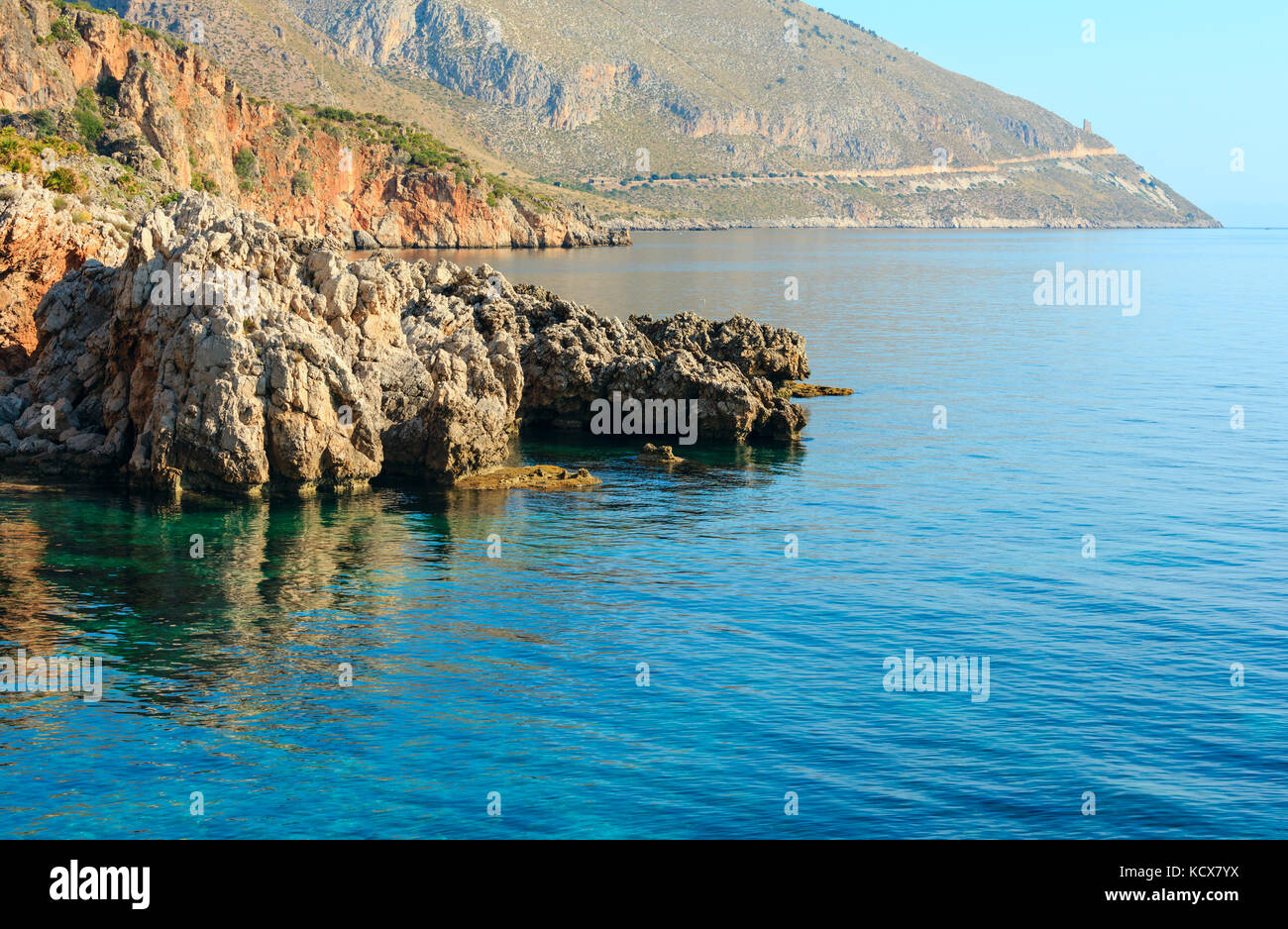 Paradise sea bay with azure water. View from coastline trail of Zingaro Nature Reserve Park, between San Vito lo Capo and Scopello, Trapani province,  Stock Photo