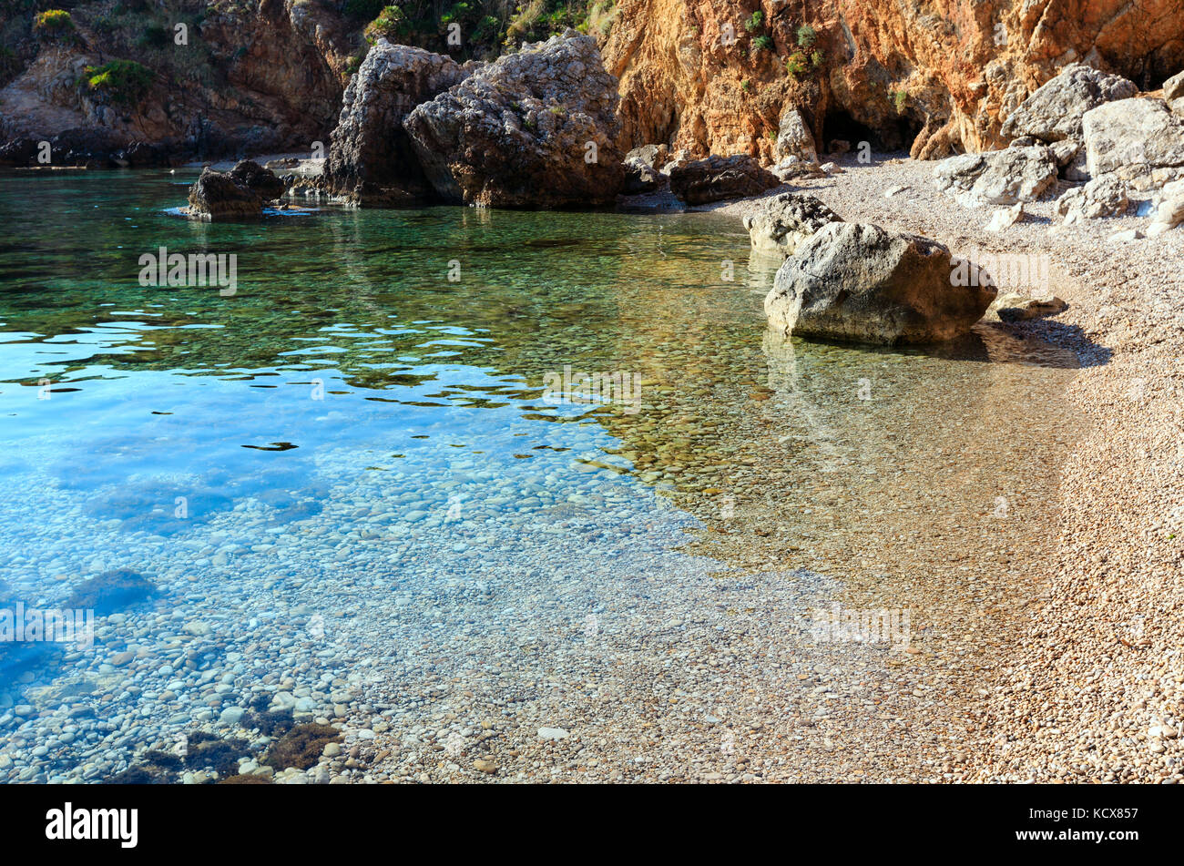 Paradise sea bay with azure water and beach (Zingaro Nature Reserve Park, Trapani province, Sicily, Italy). Stock Photo