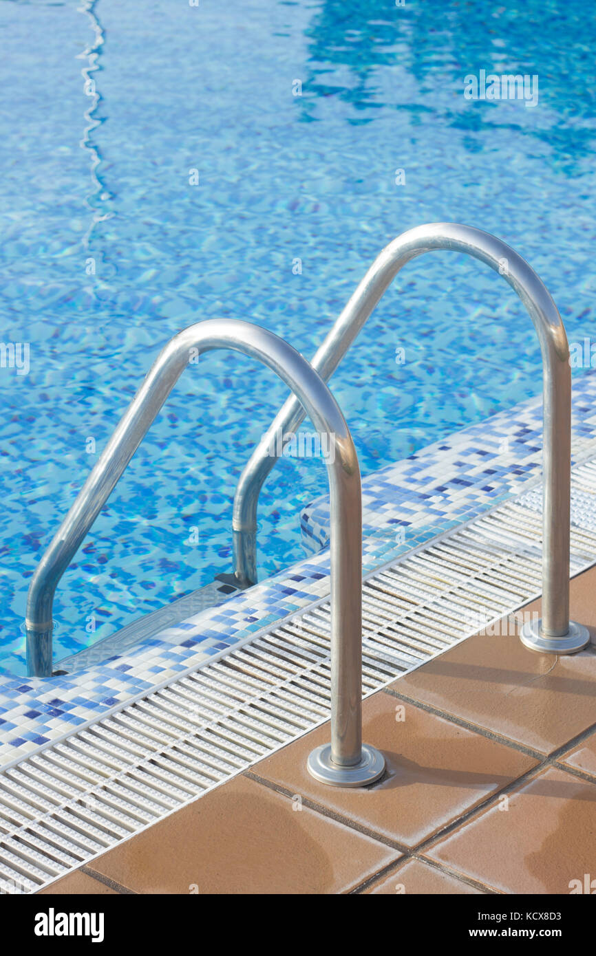 Blue swimming pool on hot sunny day on summer vacation Stock Photo - Alamy