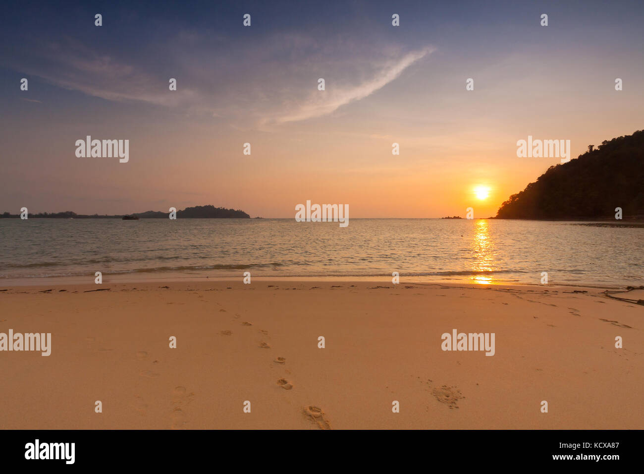 Sunset on the beach Stock Photo - Alamy