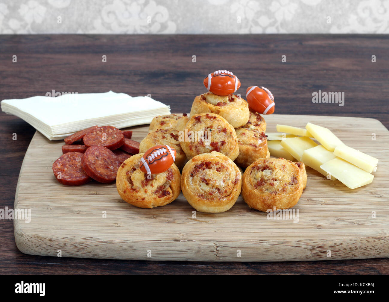 Party snacks of sliced pepperoni, cheddar cheese and pepperoni