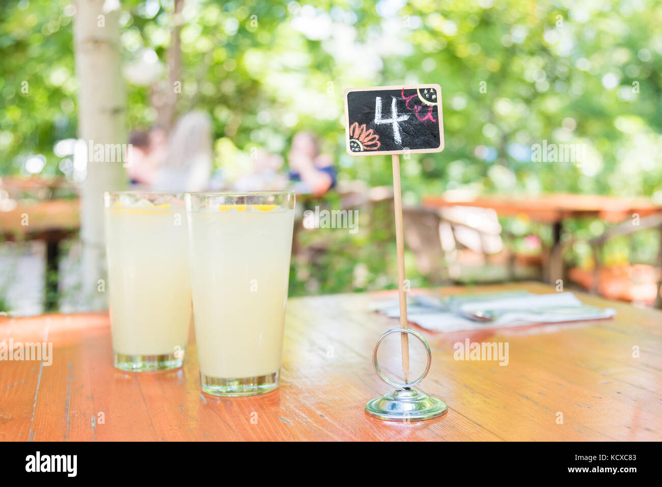 Glasses Of Lemonade On Restaurant Garden Patio Table Stock Photo