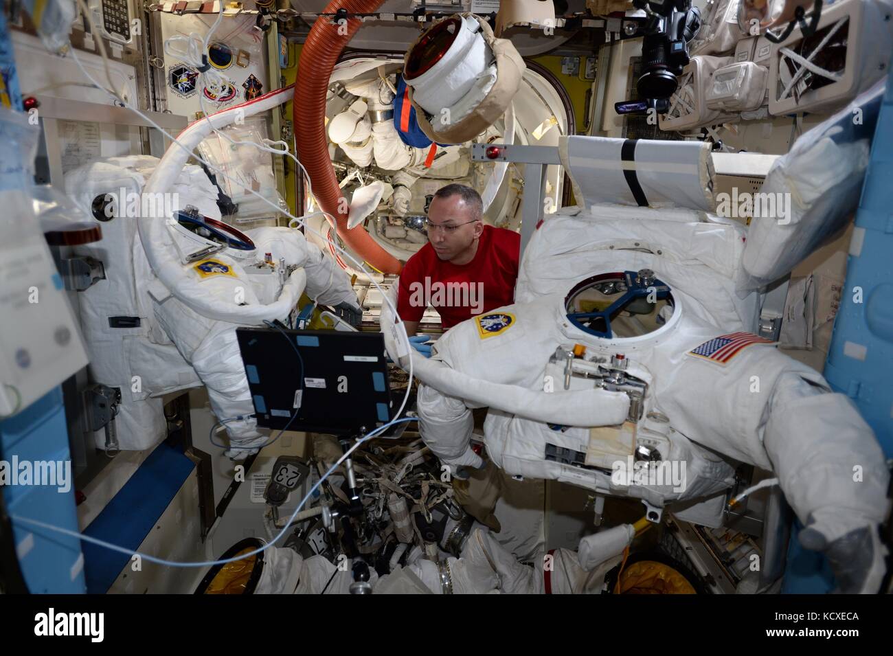 Expedition 53 American astronaut Randy Bresnik prepares his spacesuit for a spacewalk onboard the International Space Station September 30, 2017 in Earth Orbit. Stock Photo