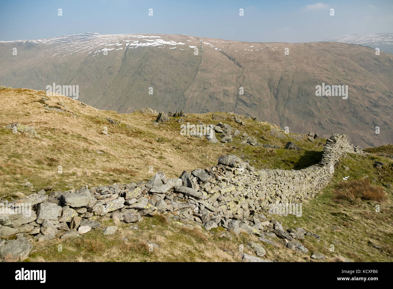 Dove Crag and High Pike from summit of Heron Pike with dry stone wall in foreground, Lake District National Park, UK Stock Photo
