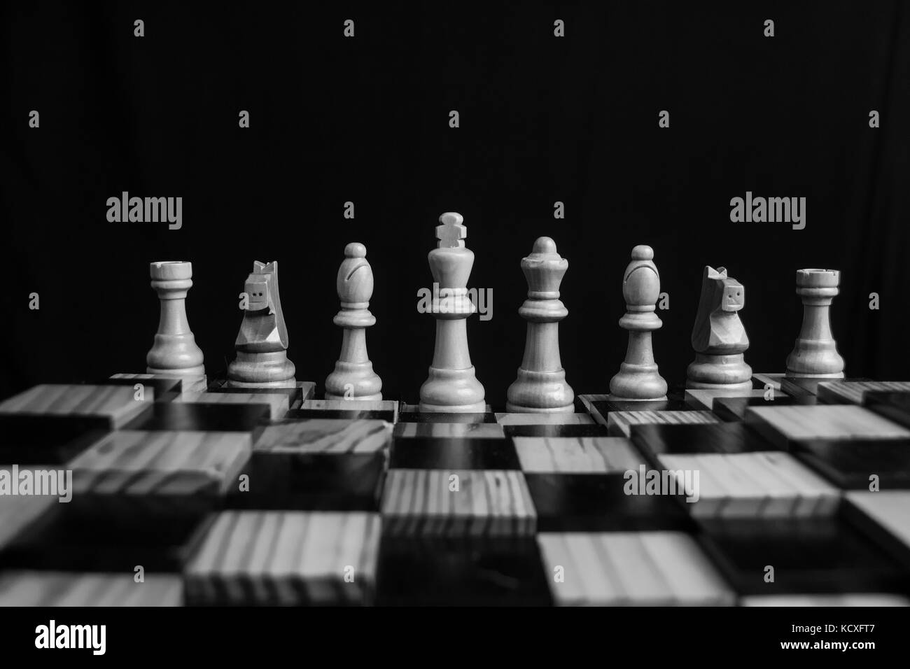 Low light photo of chess pieces and board Stock Photo