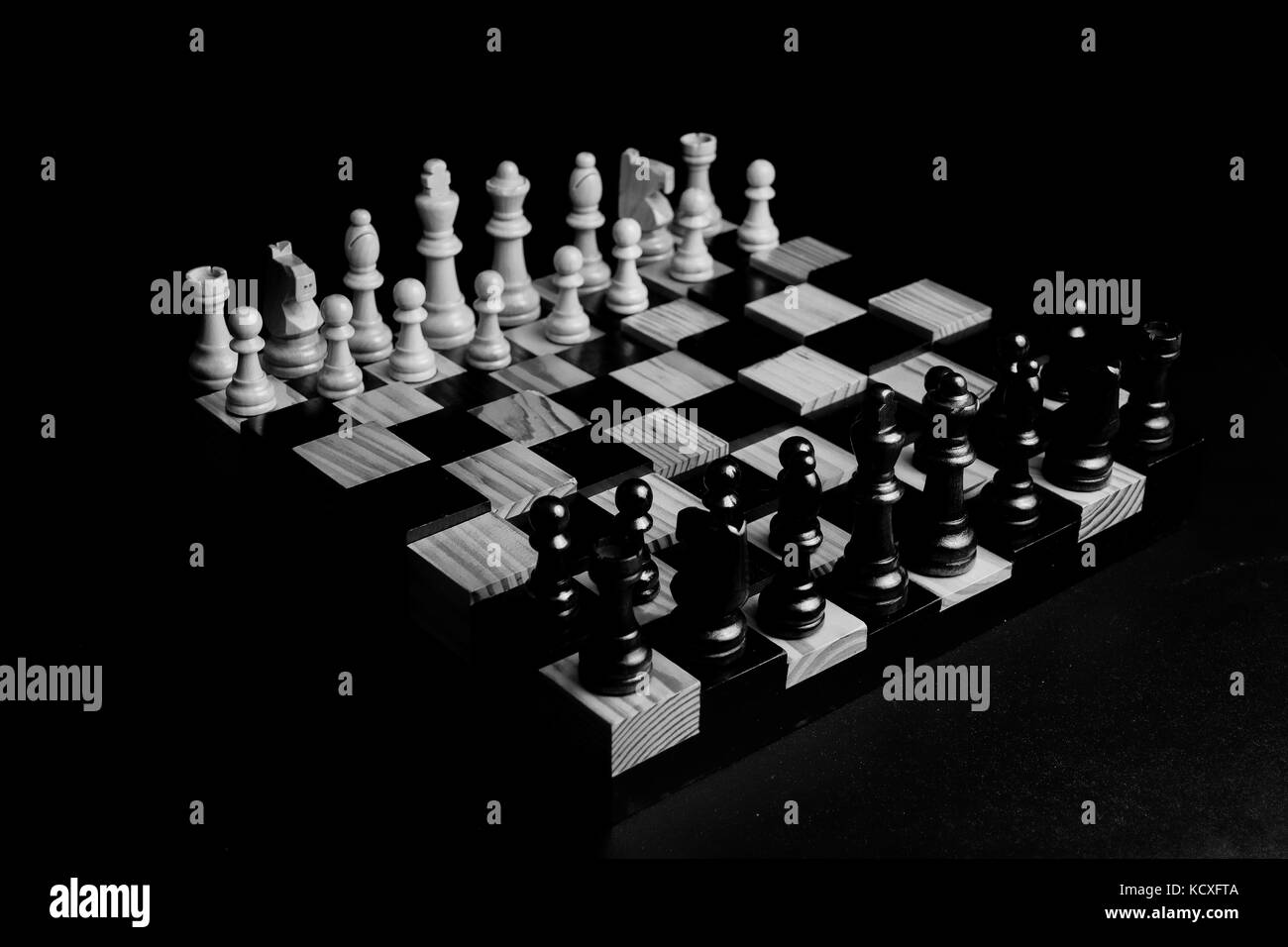 Low light photo of chess pieces and board Stock Photo