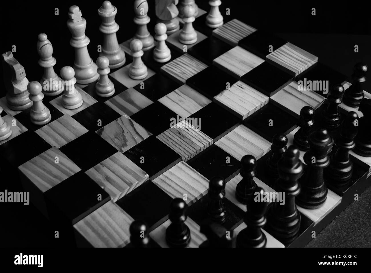 Low light photo of chess pieces and board Stock Photo