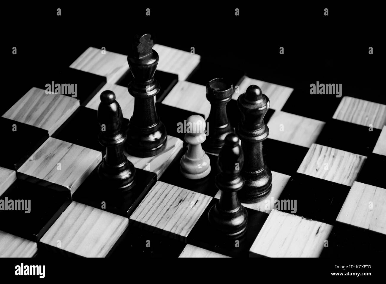 Low light photo of chess pieces and board Stock Photo