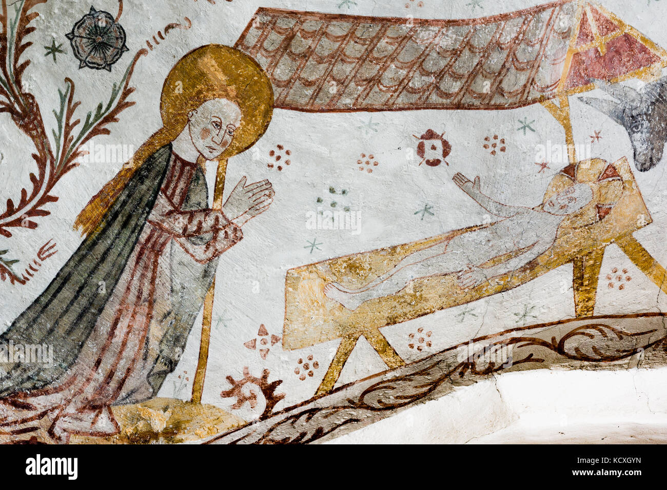 Gothic fresco of Mary kneeling in front of the Christ-child in the