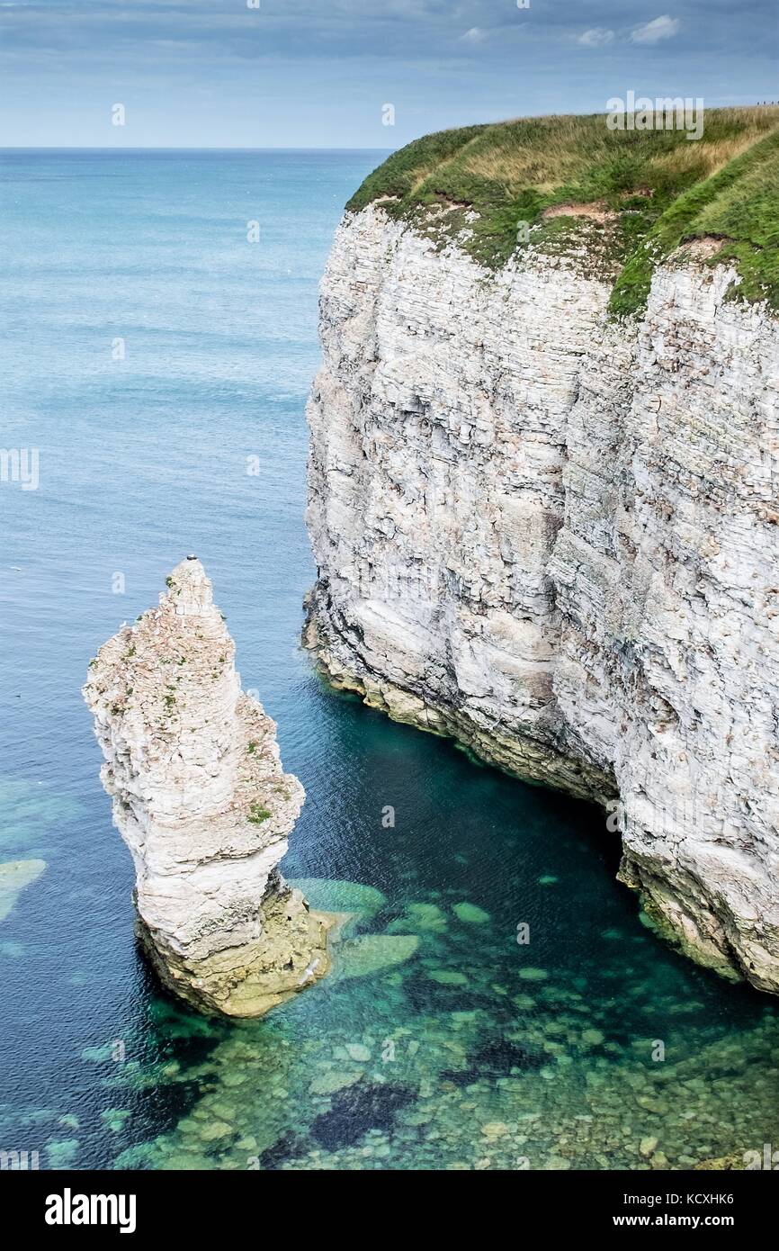 Flamborough Cliffs between Filey and Bridlington North Yorkshire. These chalk stone cliffs look stunning with the crystal clear waters lapping them. Stock Photo