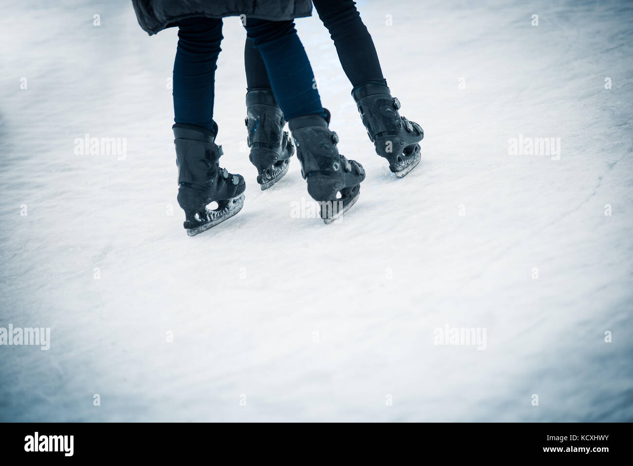Two young people skating on ice Stock Photo