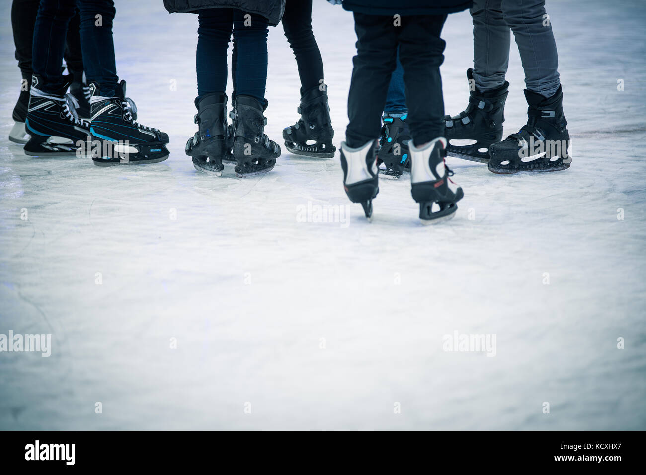 Seven young people standing on ice Stock Photo
