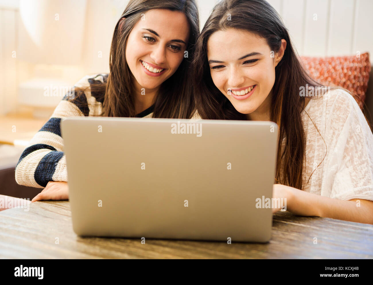 Two beautiful students working on laptop Stock Photo - Alamy