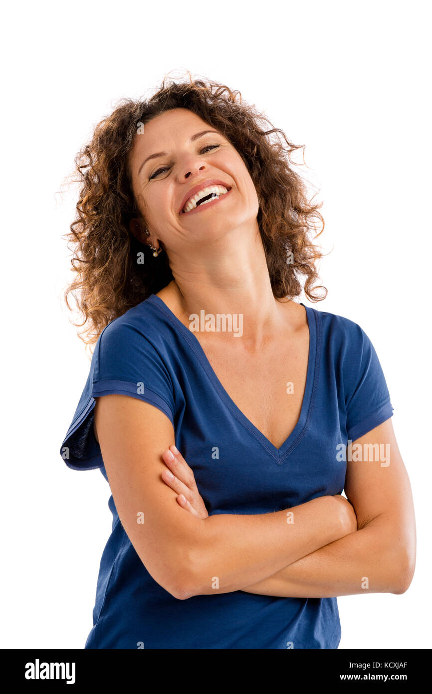Smiling middle aged woman with arms folded, isolated on white background Stock Photo