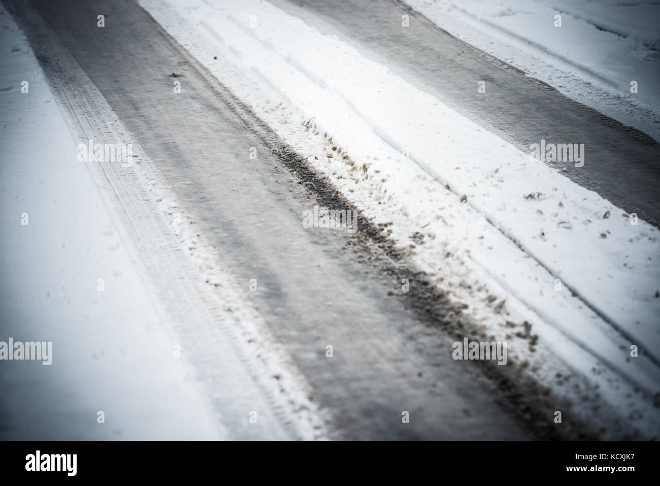 Street snow winter car traces Stock Photo - Alamy