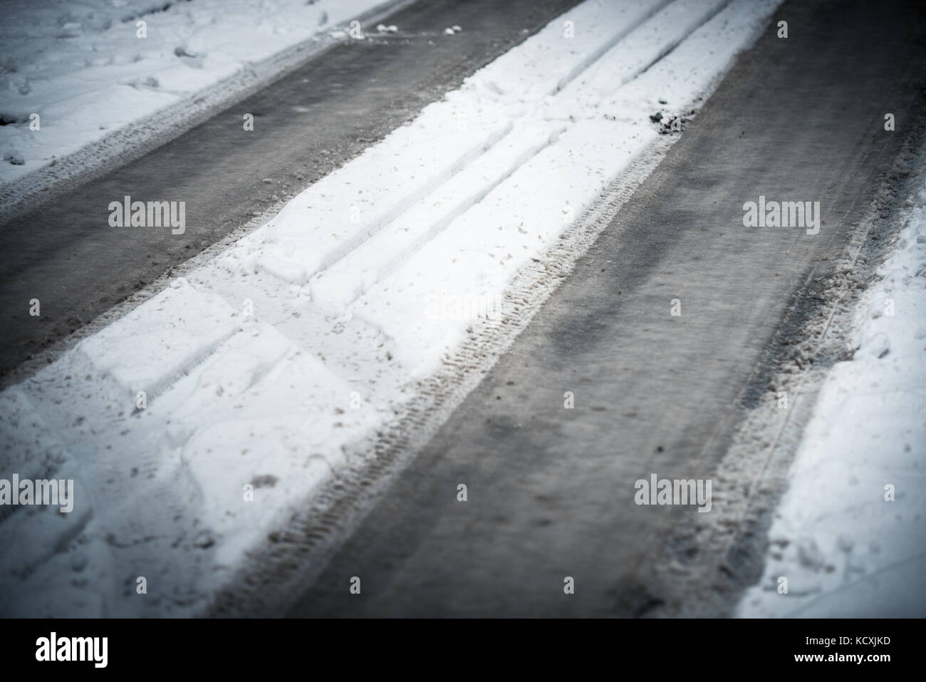 Street snow winter car traces Stock Photo - Alamy