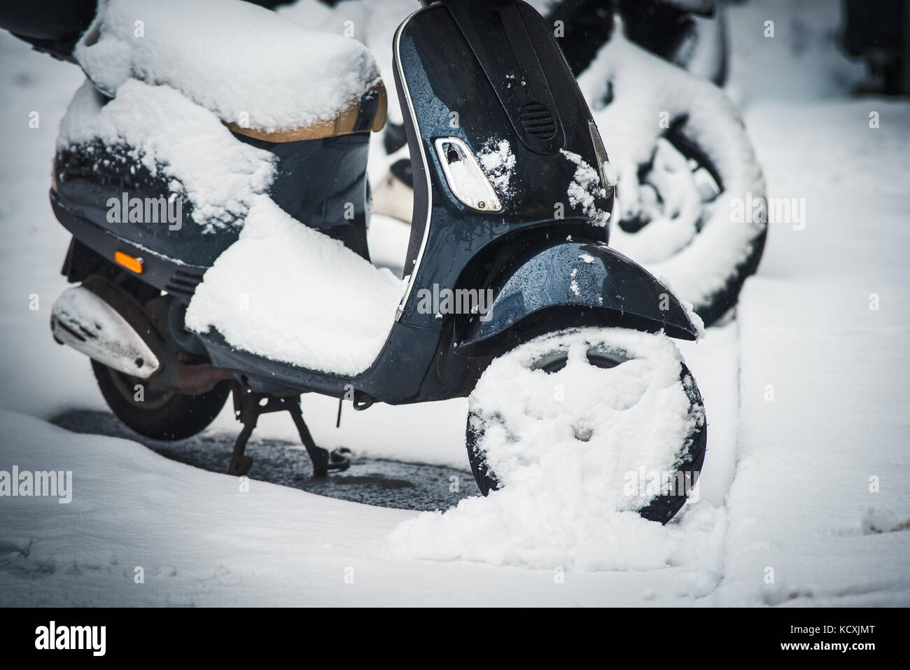 Motorcycle Scooter parking in winter on street covered with snow Stock Photo Alamy