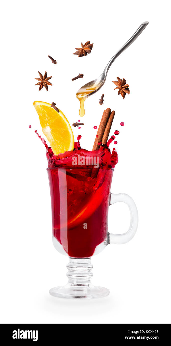 mulled wine with splash and flying ingredients Stock Photo