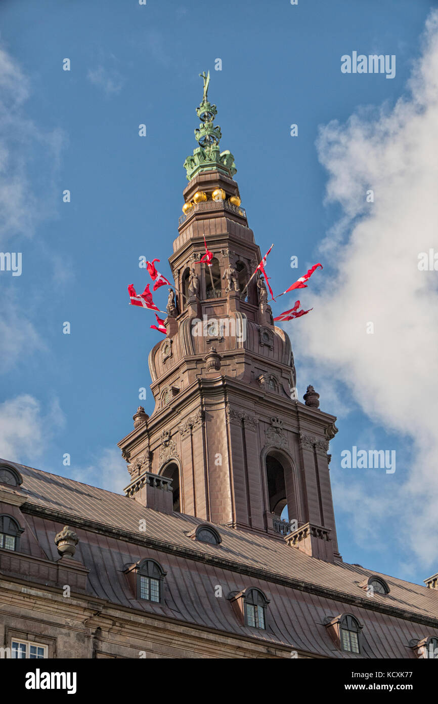 COPENHAGEN, DENMARK - OCTOBER,3 , 2017: Opening of Parliament. The flags on the tower. Christiansborg castle, Copenhagen, Denmark. Stock Photo