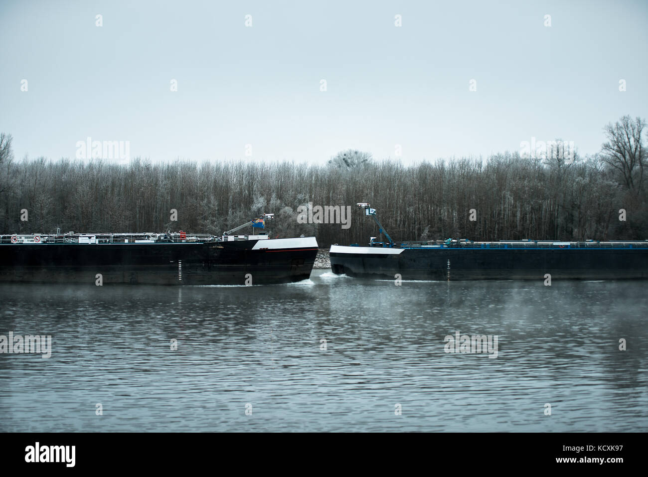 Two Ships on a river in huge fog mist cold winter day Stock Photo - Alamy