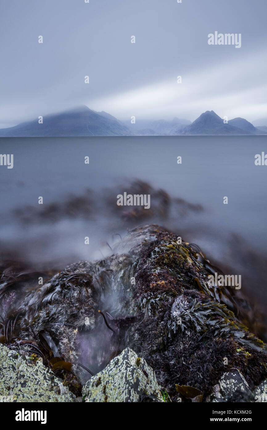 Elgol Beach With The Cuillin Mountains in the distance. Isle Of Skye, Scotland, UK Stock Photo