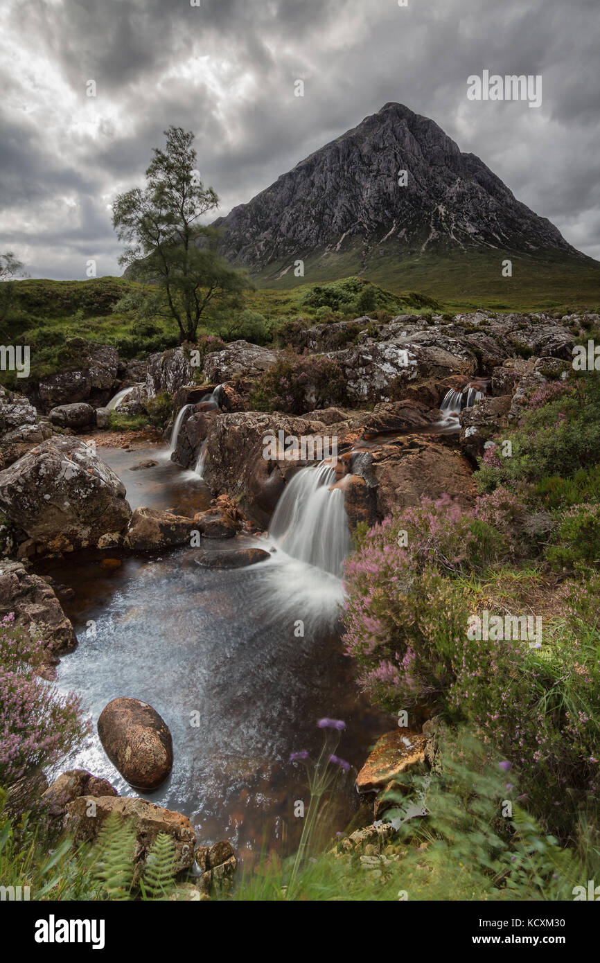 Buachaille Etive Mòr Mountain with waterfall from River Coupall in Scotland, UK Stock Photo