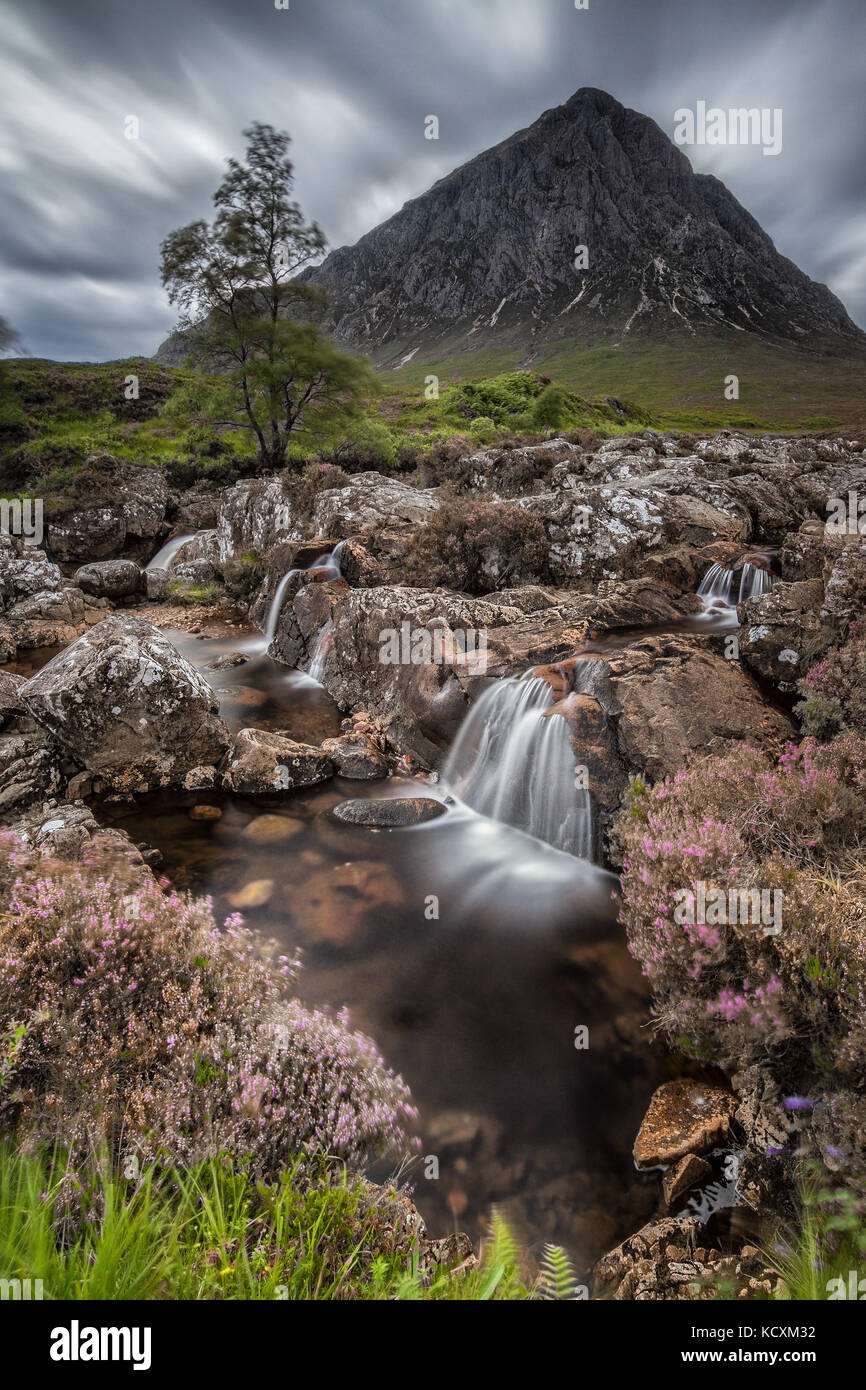 Buachaille Etive Mòr Mountain with waterfall from River Coupall in Scotland, UK Stock Photo