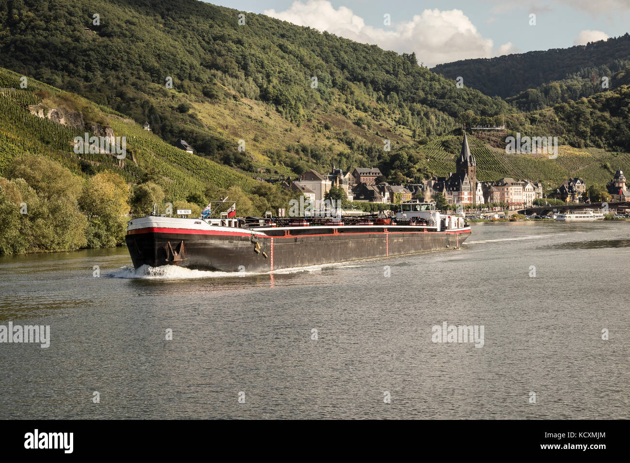A barge, - TMS Partner on the Mosel River, Germany at Berncastel-Kues Stock Photo
