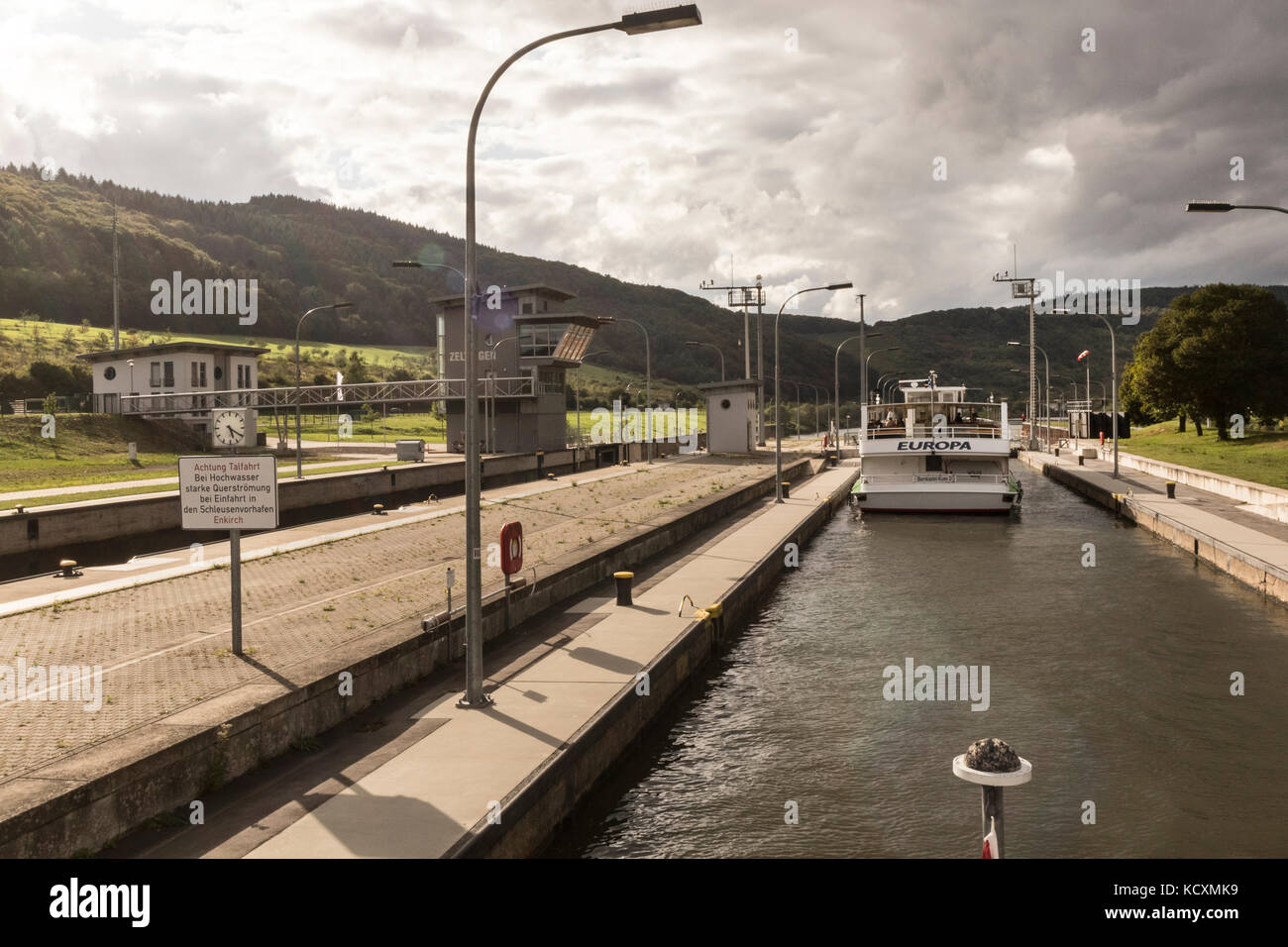 A pleasure boat going through the river lock on the Mosel River, at Bernkastel-Kues Germany Stock Photo